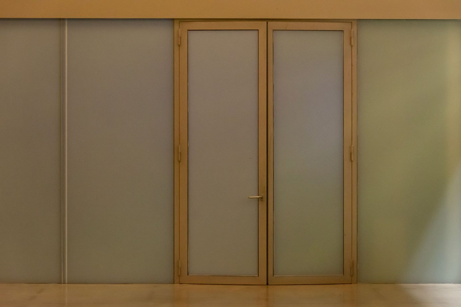 Modern commercial office building entrance with professional security access