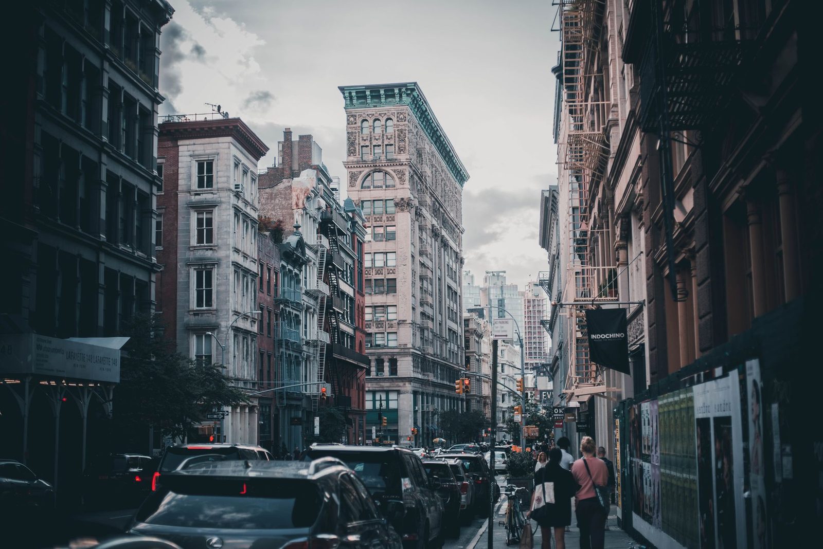 Brooklyn neighborhood street with brownstone buildings and tree-lined sidewalks
